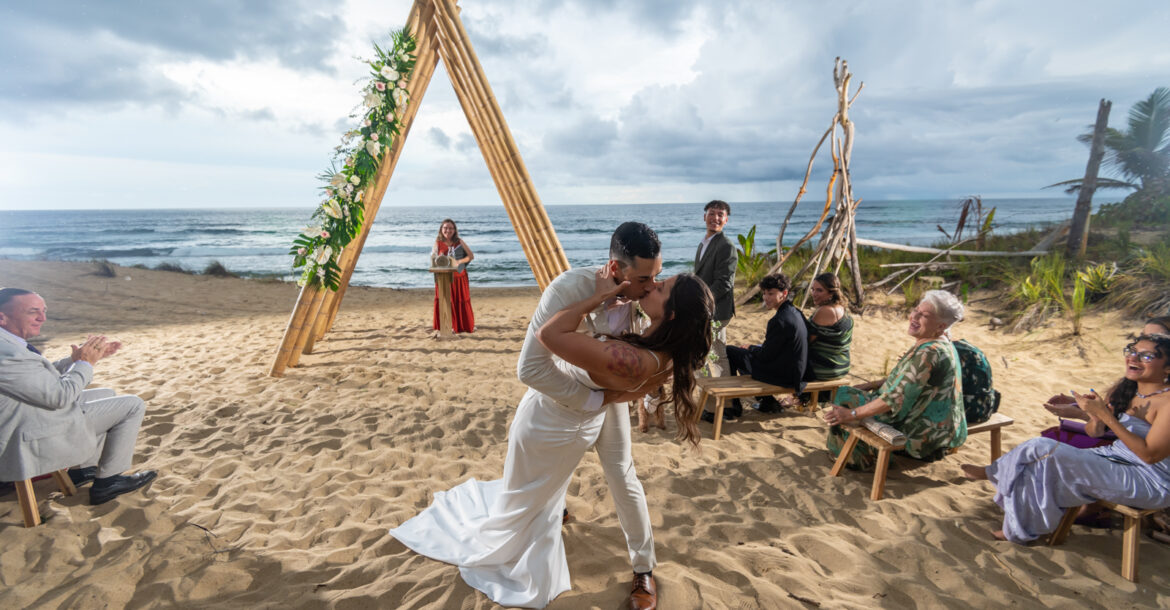 post wedding ceremony couple kissing on the beach